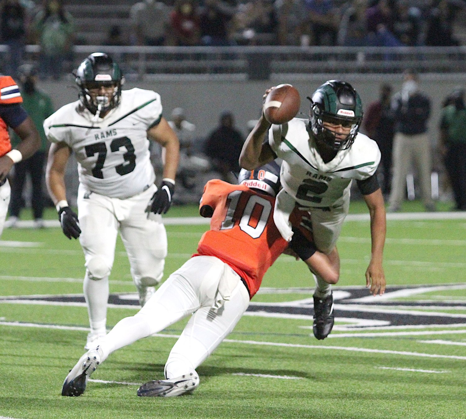Seven Lakes' Scott Stanford (10) upends Mayde Creek quarterback Jace Wilson during the Spartans' win over Mayde Creek on Nov. 13 at Legacy Stadium.